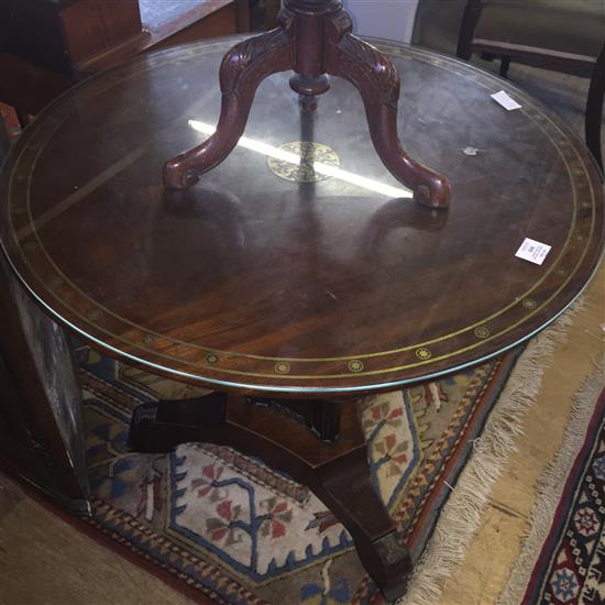 A Regency circular mahogany and brass inlaid tilt top centre table, retailers stamp for Edwards and Roberts, W.2ft 9in.